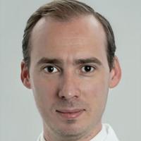 Portrait image of Ari Jody Mintz in his white lab coat